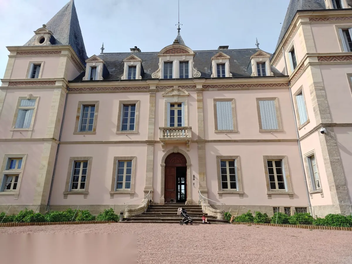 Wide panoramic view of the Chazeuil château façade with its Louis XIII turrets and honey-coloured stone