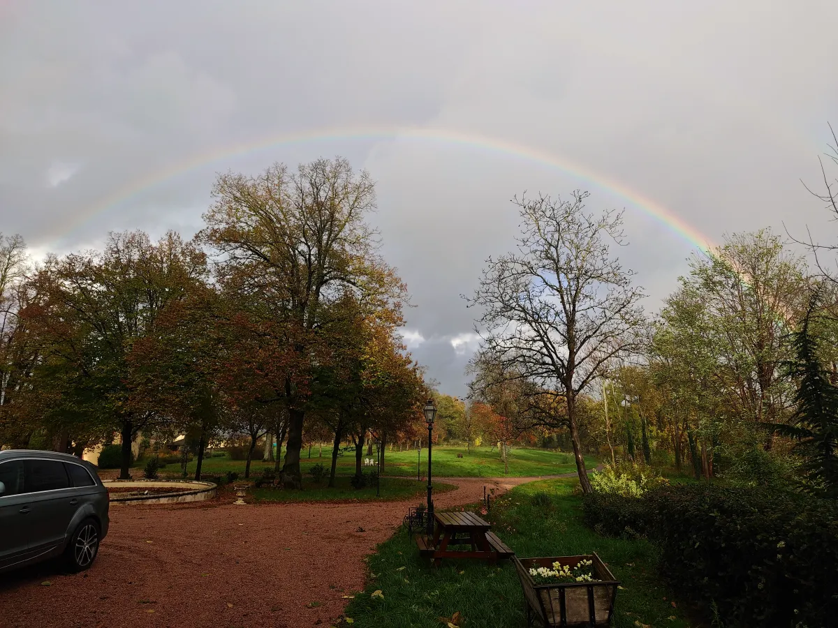 Rainbow arching over the pond