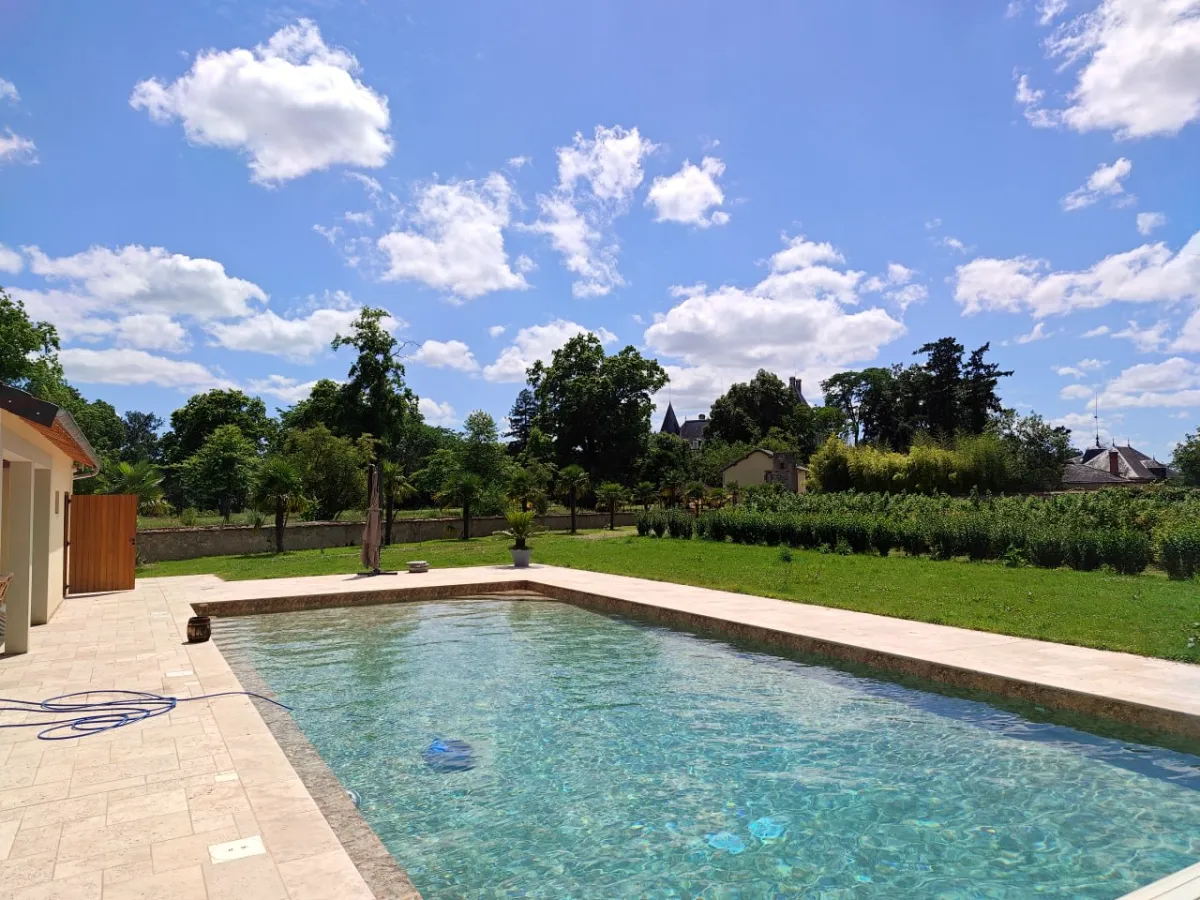 Panoramic view of pool and orchard