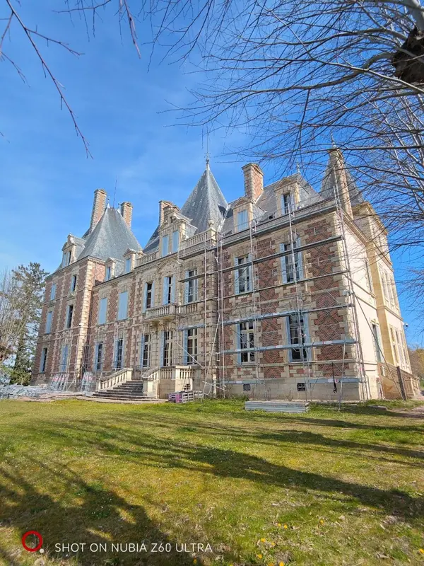 The brick elevation under a deep blue sky
