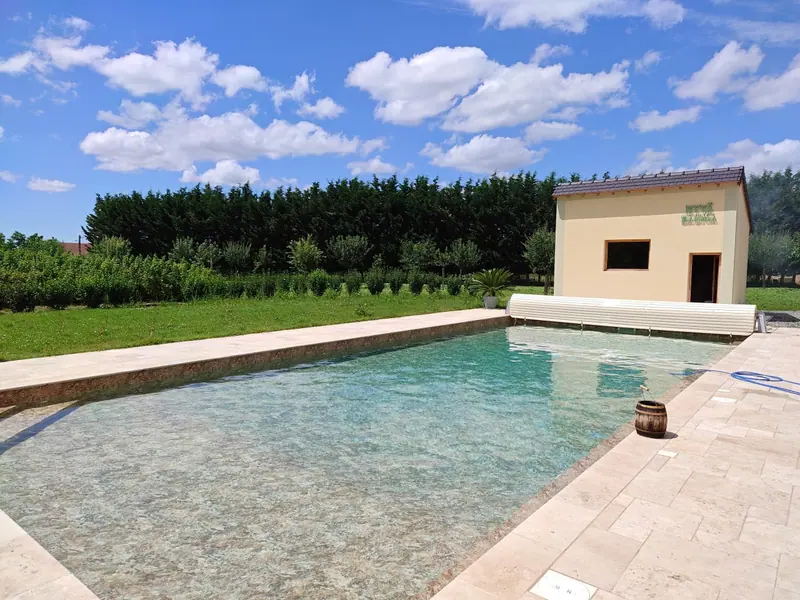 Long view down the pool towards the pool house