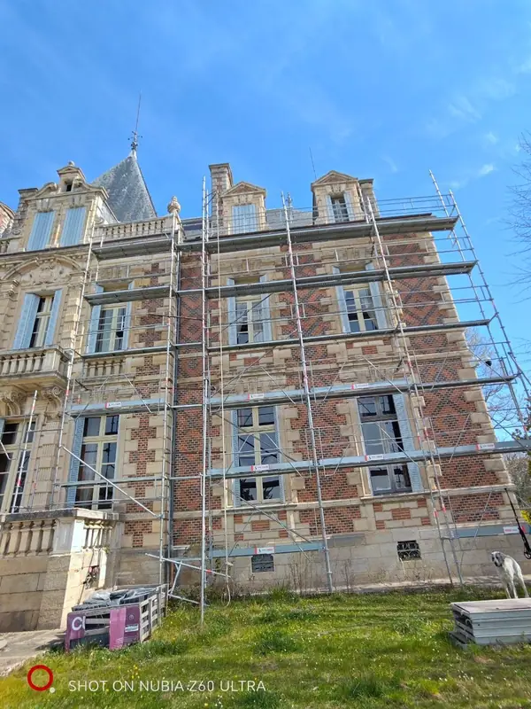Scaffolding across the brick facade during restoration